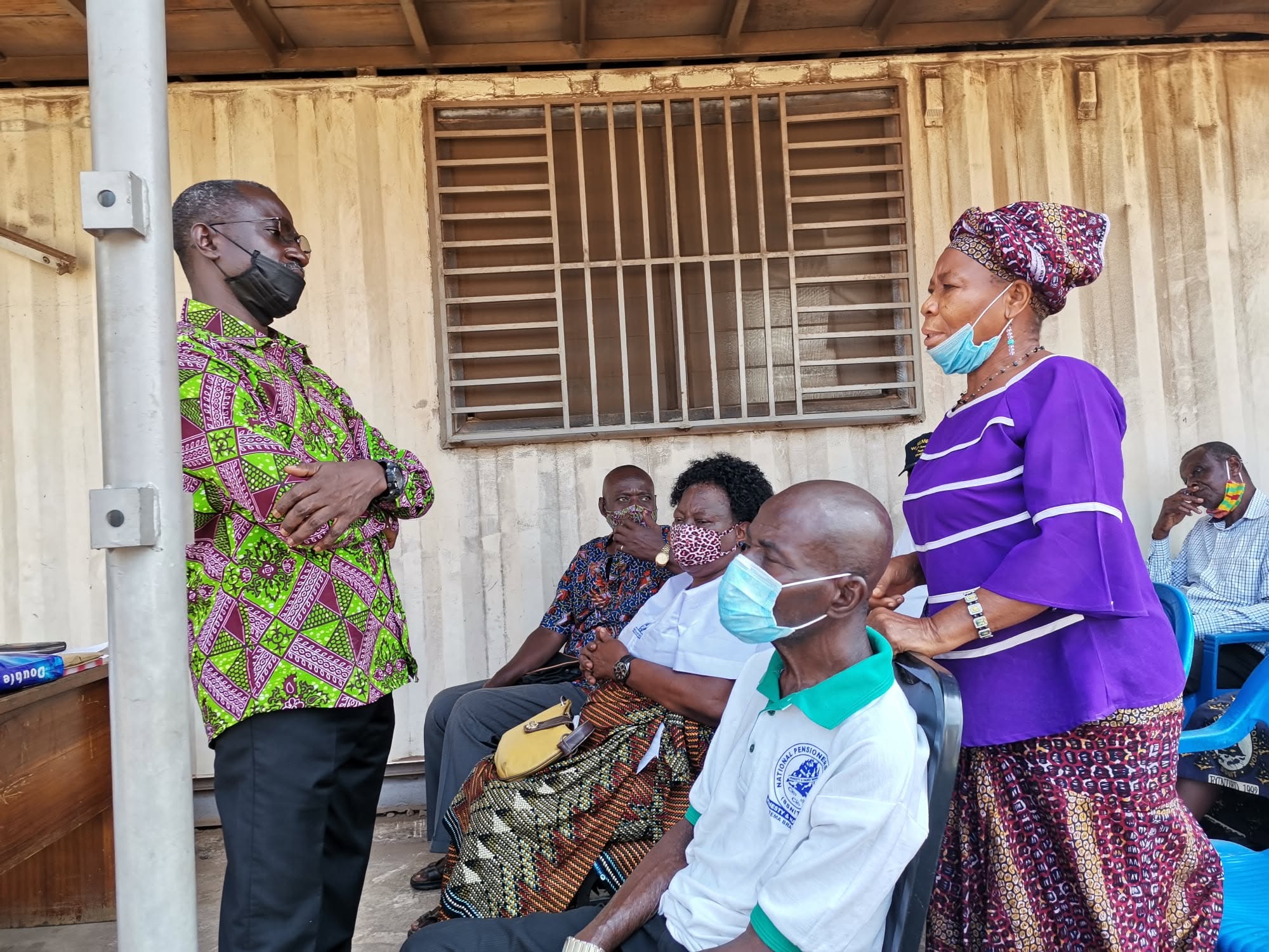 Dr. Danso consulting with an elderly patient